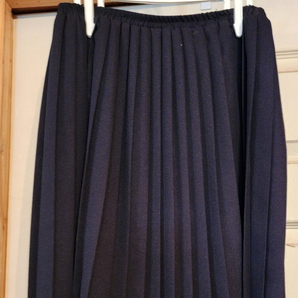 Black pleated skirt.